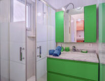 indoor, wall, bathroom, green, plumbing fixture, countertop, home appliance, cabinetry, tap, drawer, shower